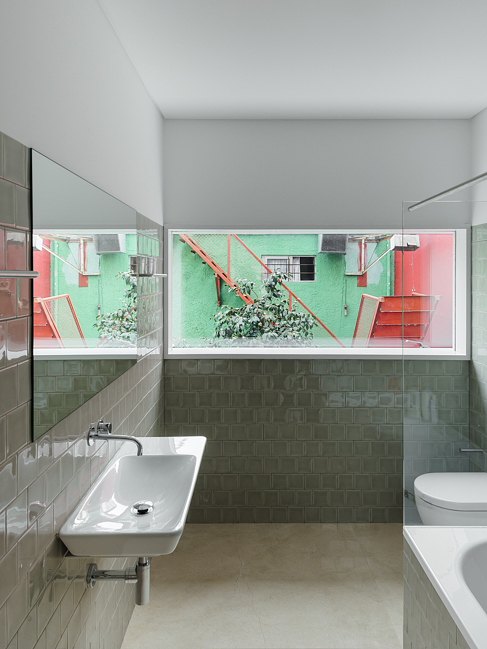 House in Porto is a narrow concrete house that falls within historical houses in Portugal