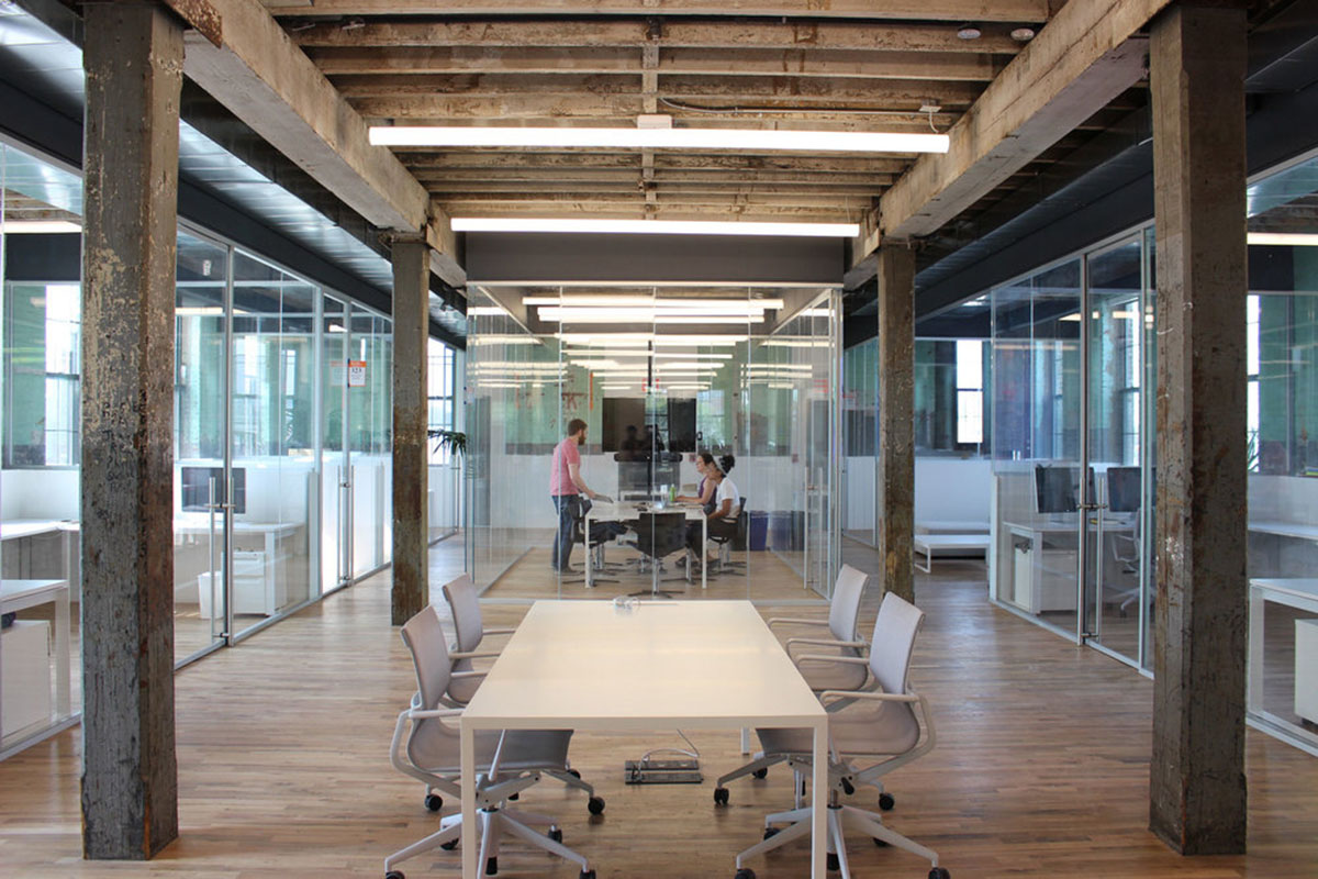 LEESER Architecture transforms an industrial building into office headquarters for Genius Media