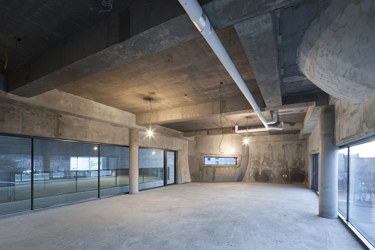 Moon Hoon Architects completed ’’Two Moon’’: a multi use building comprises two-segmented pieces