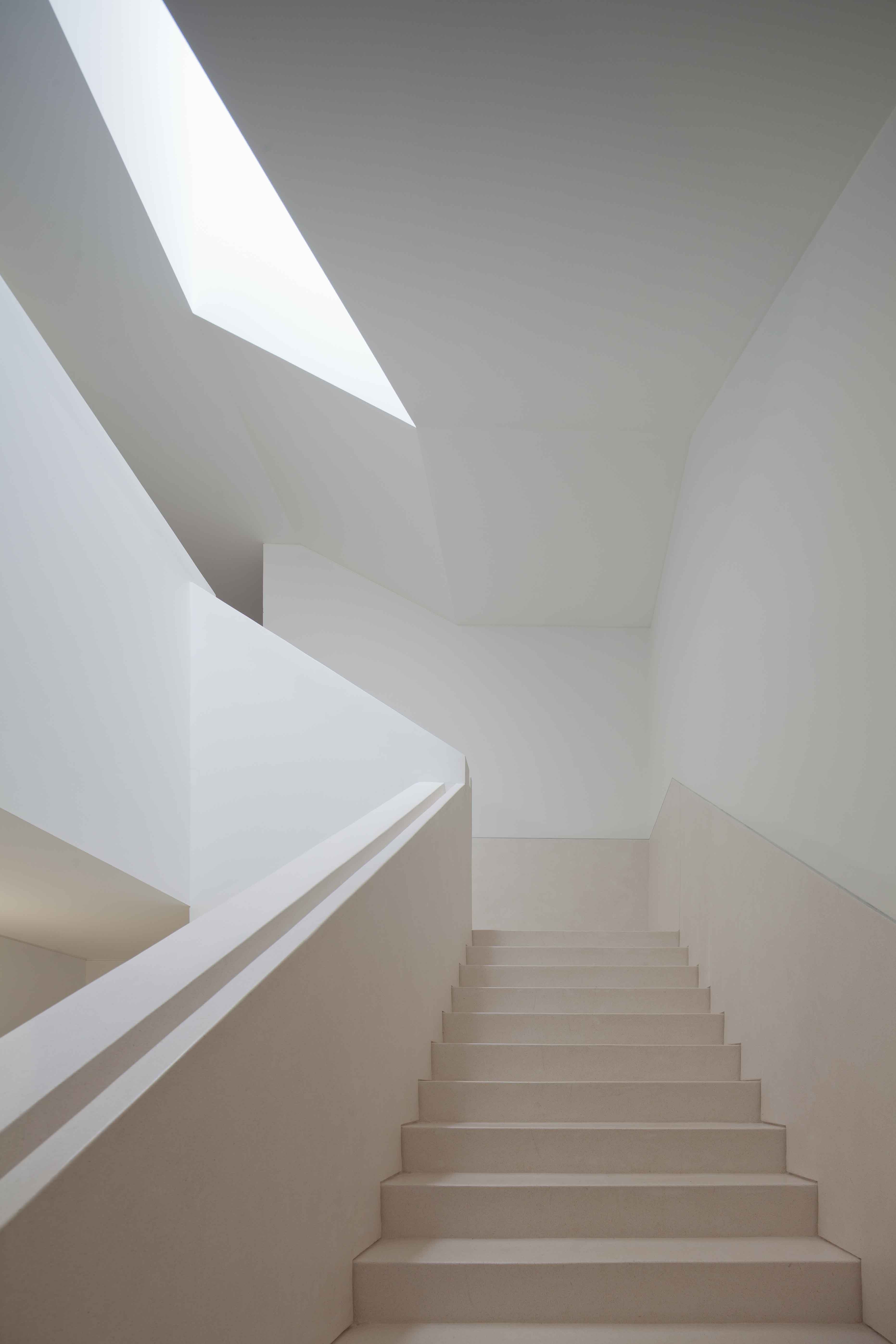 The new Melgaço Sports School is a pure and calm modernist building integrating with landscape