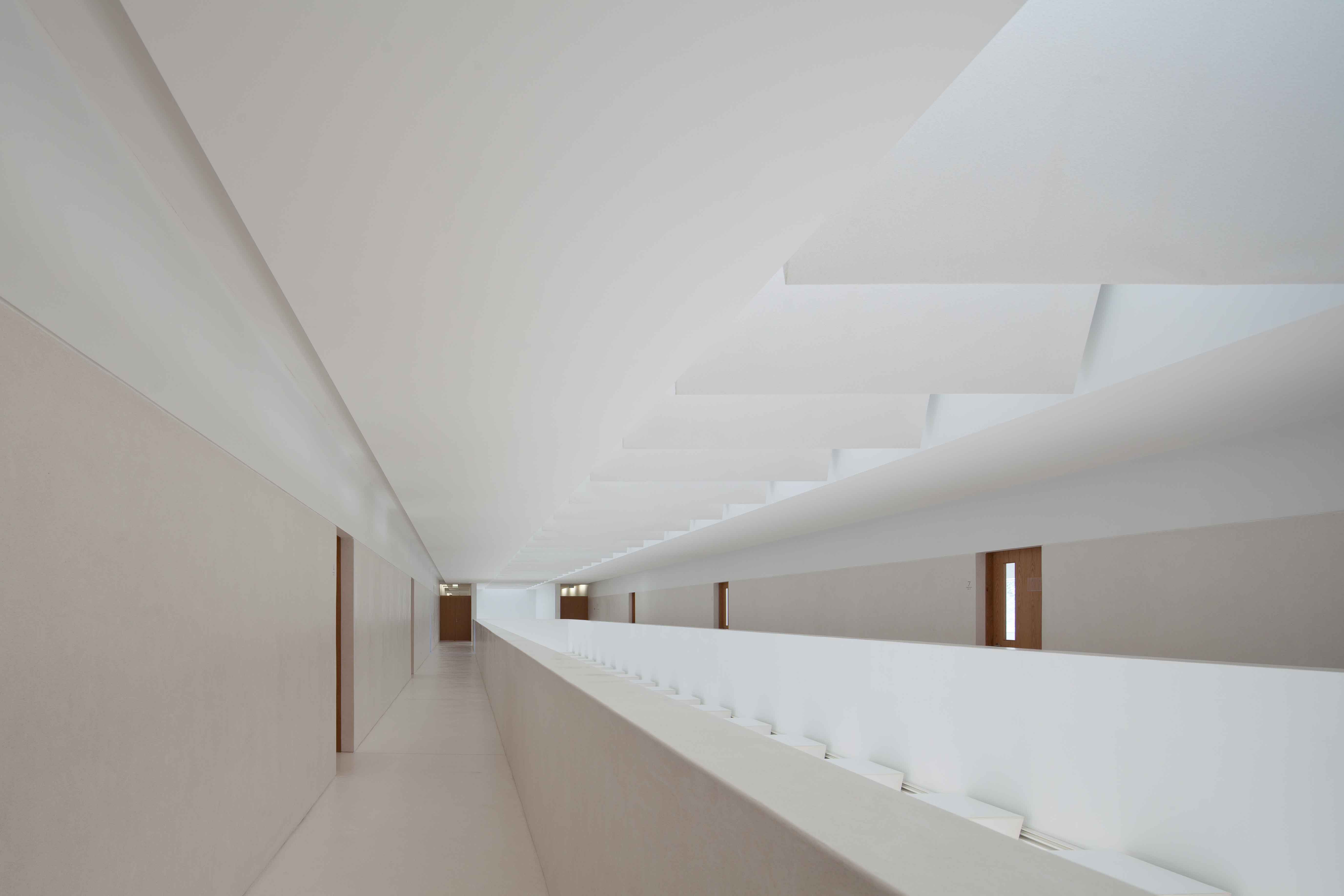 The new Melgaço Sports School is a pure and calm modernist building integrating with landscape