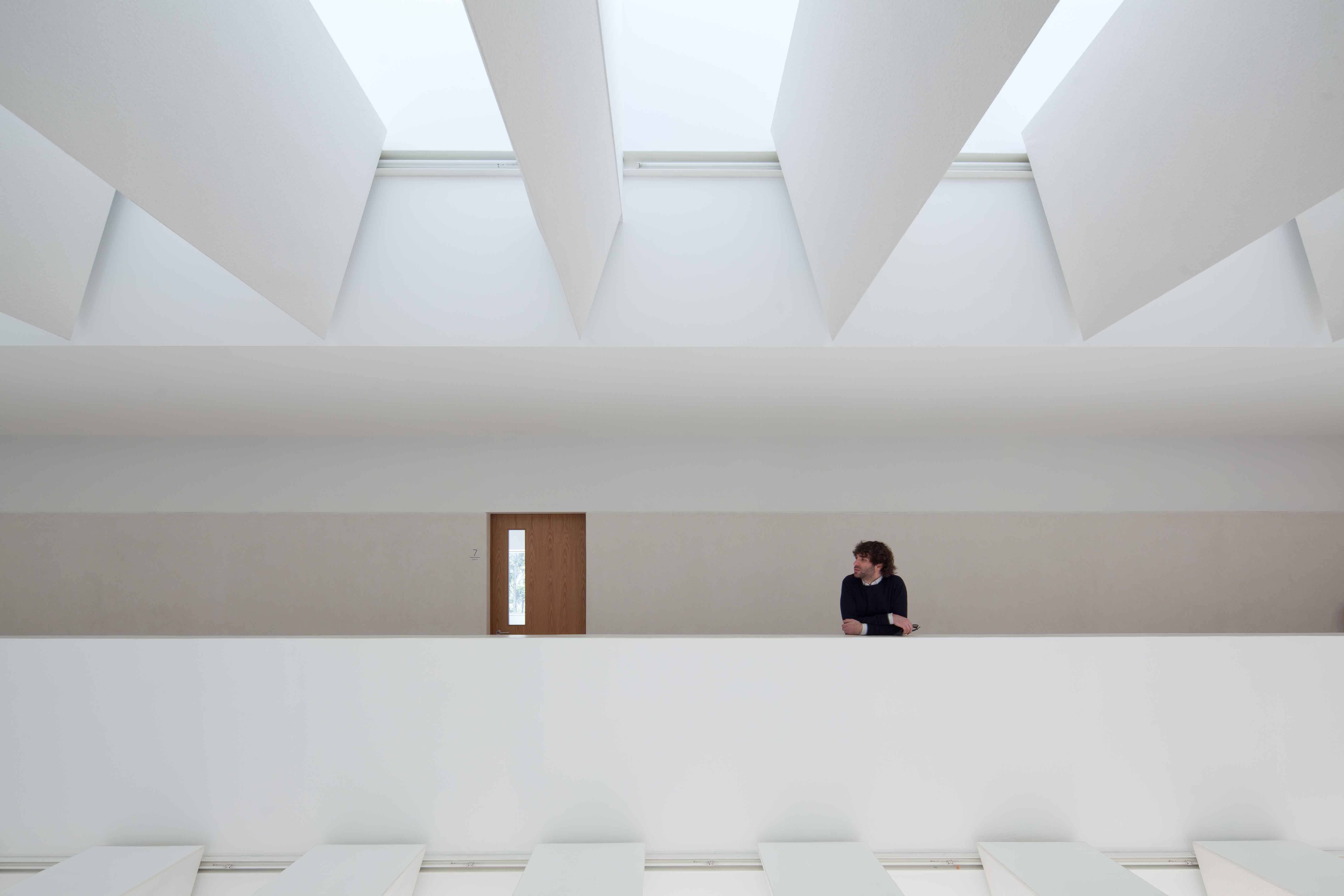 The new Melgaço Sports School is a pure and calm modernist building integrating with landscape