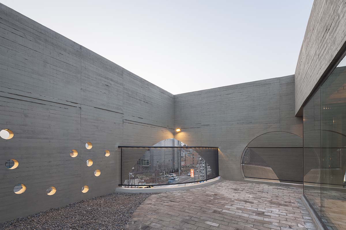 Moon Hoon Architects completed ’’Two Moon’’: a multi use building comprises two-segmented pieces