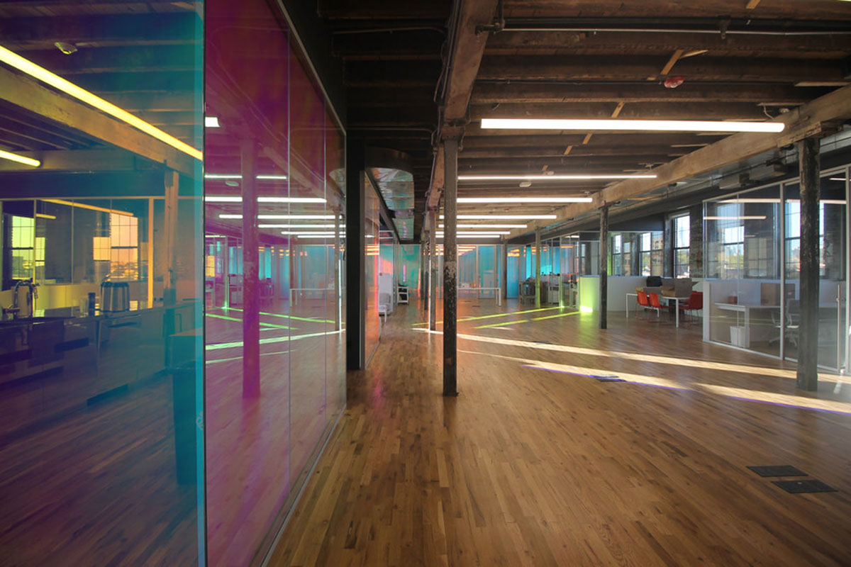 LEESER Architecture transforms an industrial building into office headquarters for Genius Media