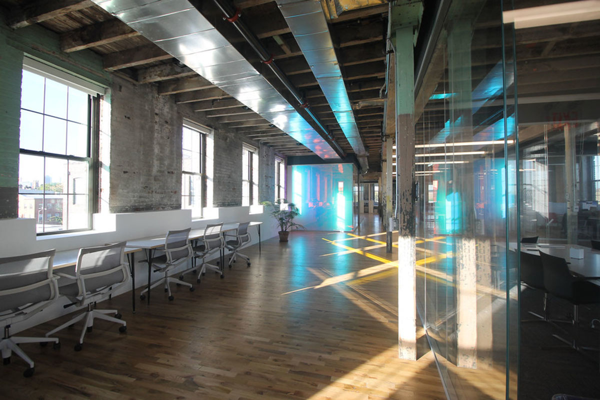 LEESER Architecture transforms an industrial building into office headquarters for Genius Media