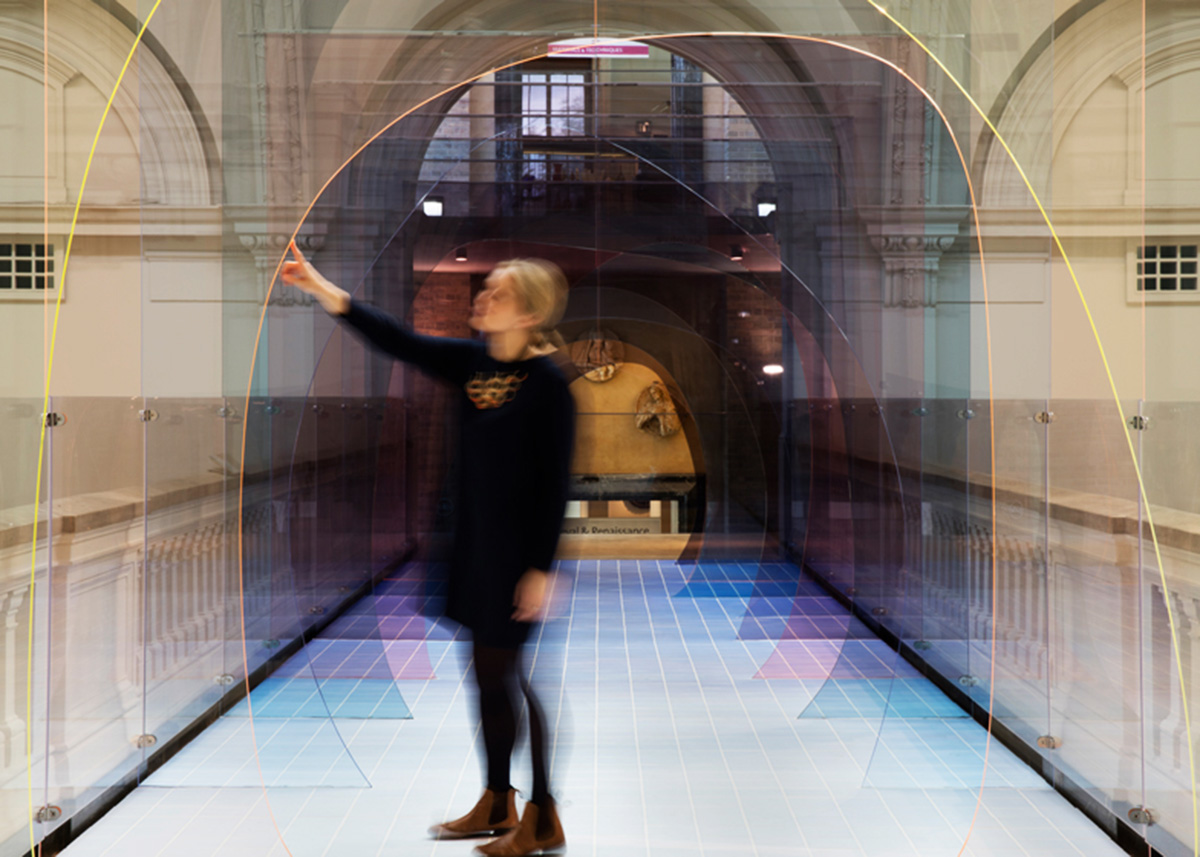 Designers play with our sense of perspective by installing this coloured acrylic tunnel in V&A