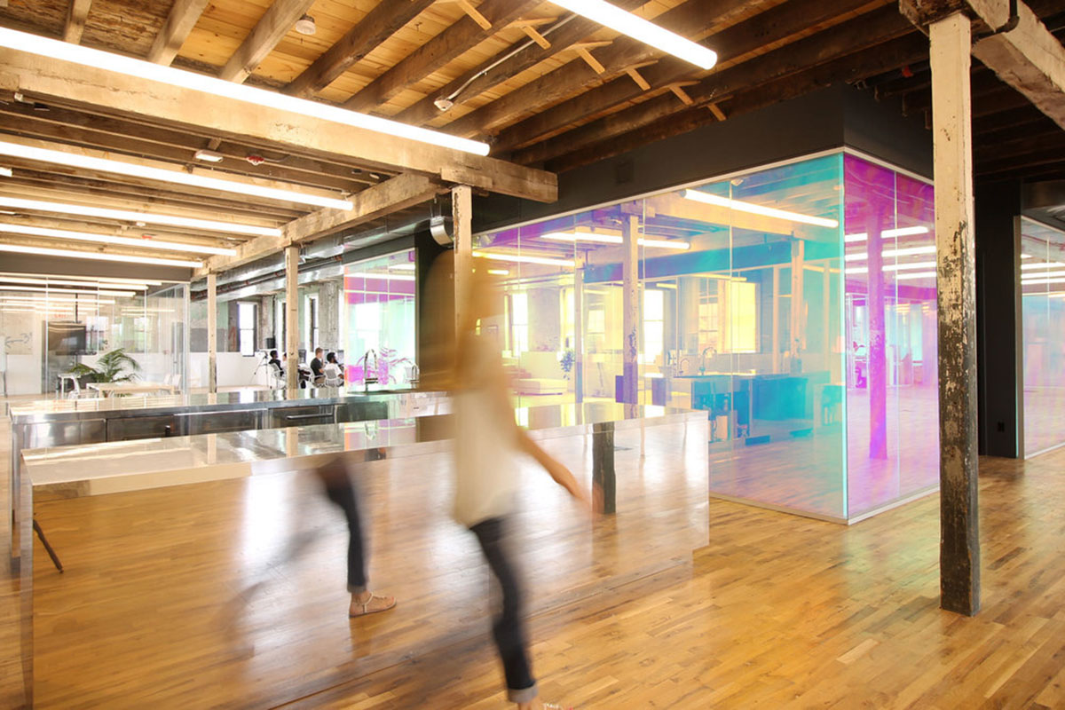 LEESER Architecture transforms an industrial building into office headquarters for Genius Media