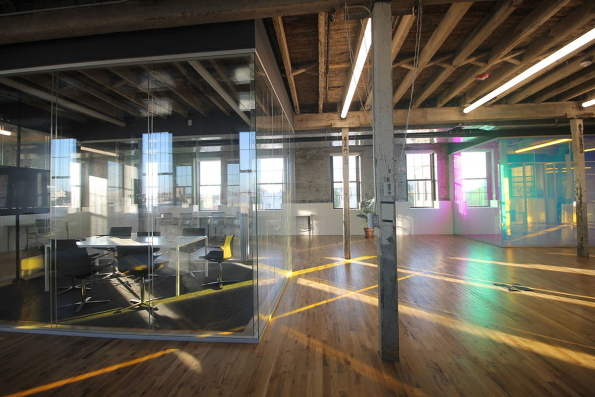 LEESER Architecture transforms an industrial building into office headquarters for Genius Media