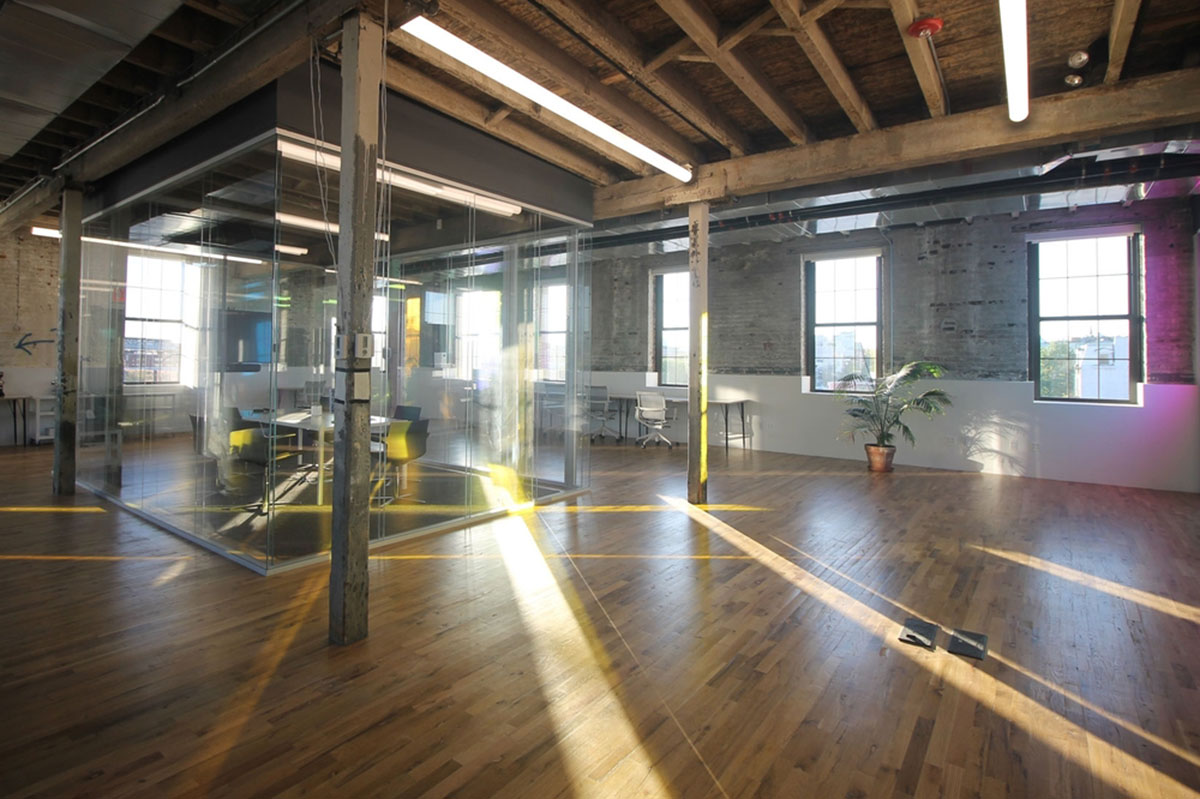 LEESER Architecture transforms an industrial building into office headquarters for Genius Media