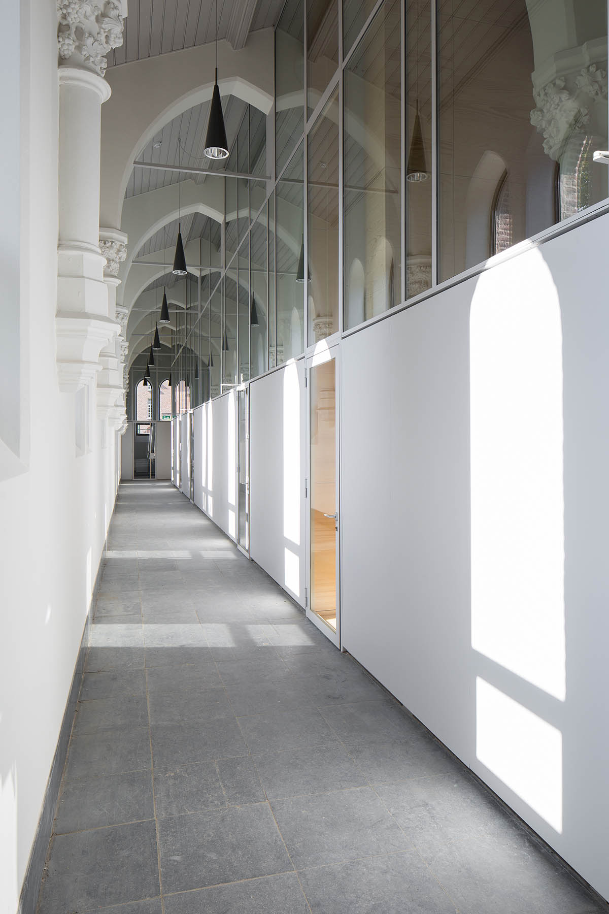 Architect Rob Hootsmans converts old church-style chapel into a new school in Belgium