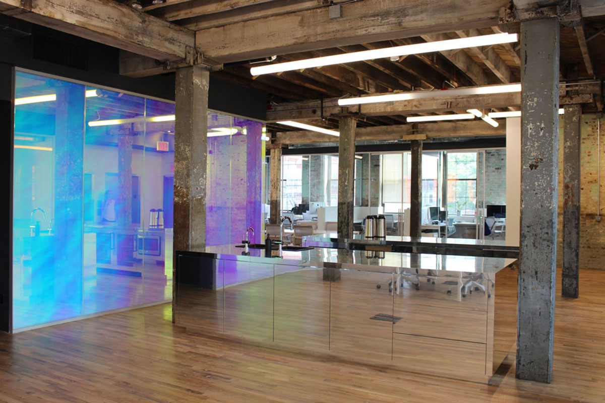 LEESER Architecture transforms an industrial building into office headquarters for Genius Media