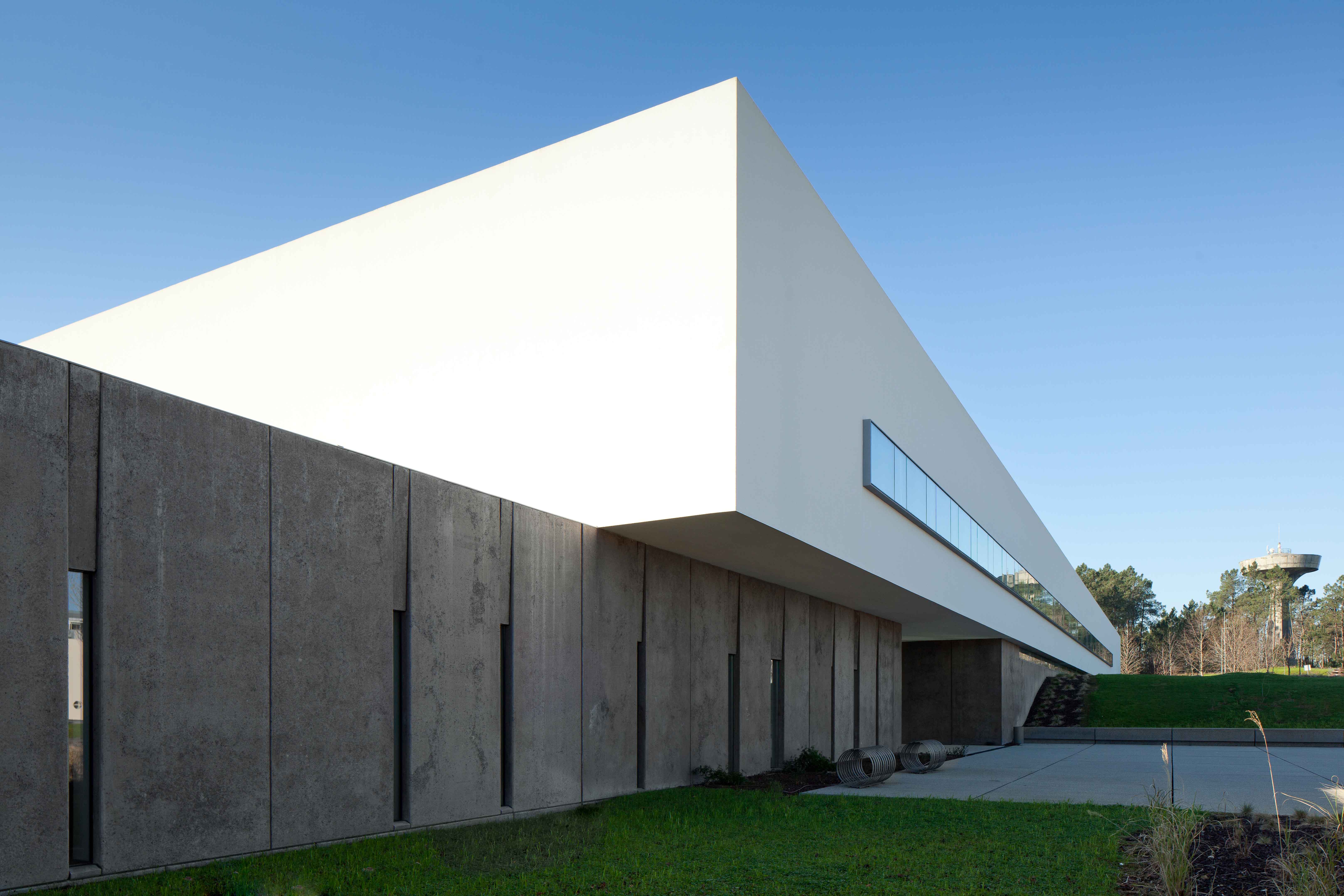 The new Melgaço Sports School is a pure and calm modernist building integrating with landscape