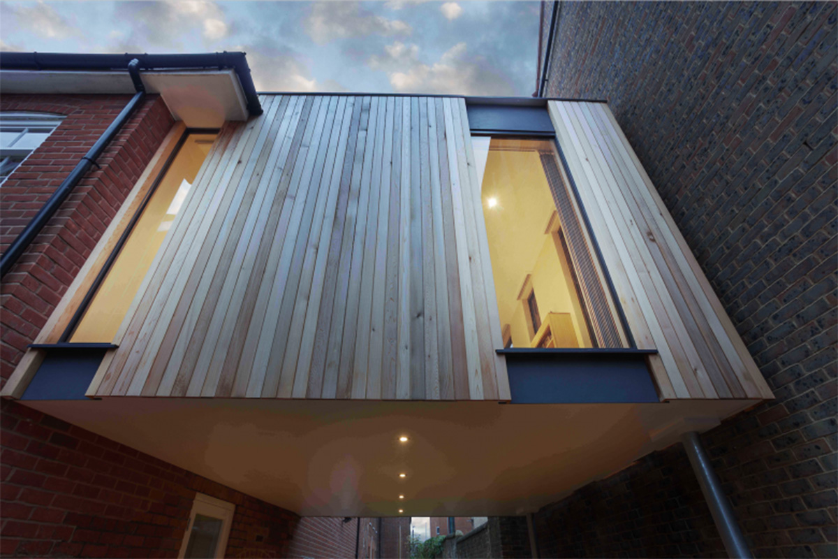 Adam Knibb Architects fills old school site with timber-box addition in Winchester
