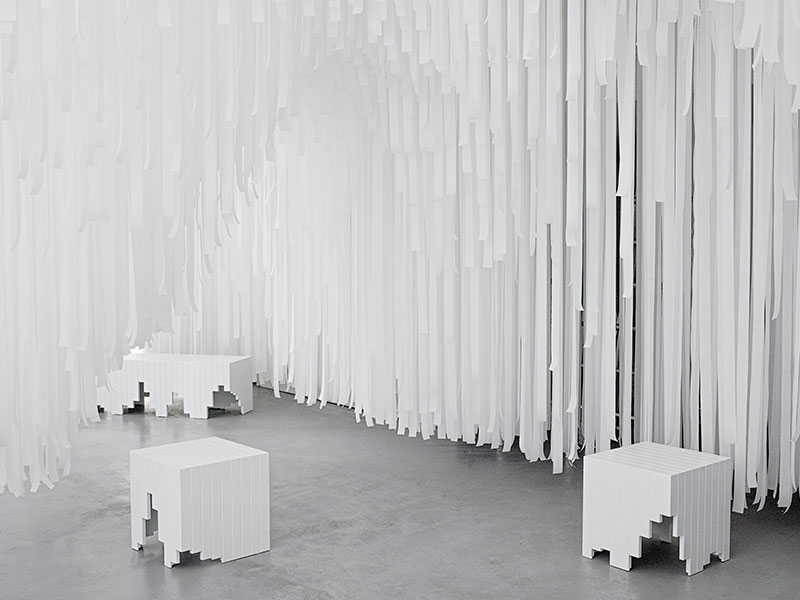 Snarkitecture creates a ’’cave’’ with paper-tissued suspended waves