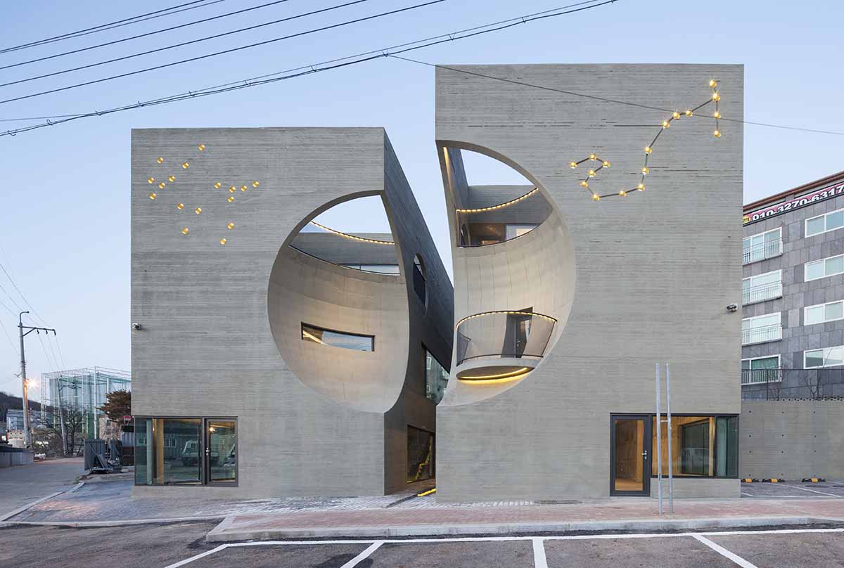 Moon Hoon Architects completed ’’Two Moon’’: a multi use building comprises two-segmented pieces