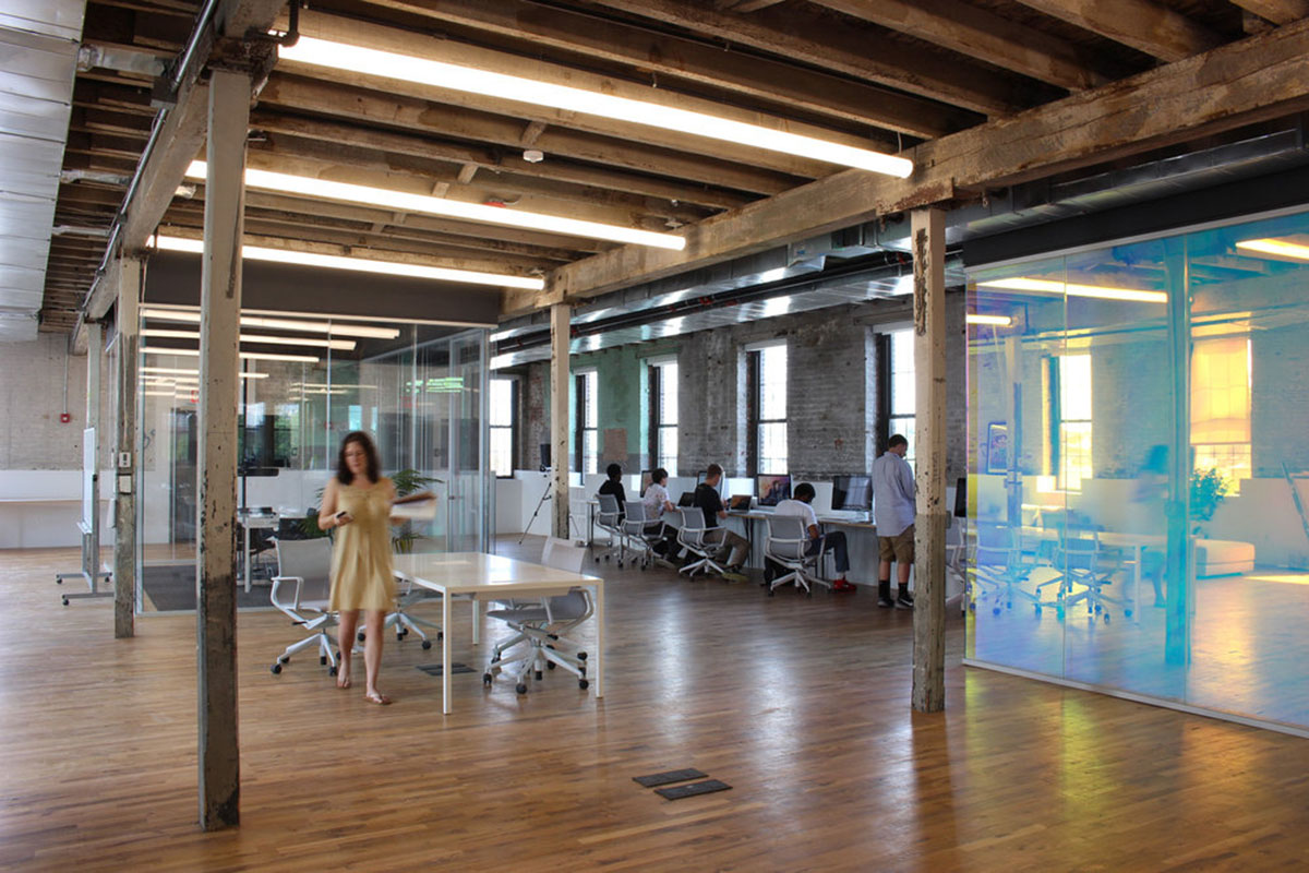 LEESER Architecture transforms an industrial building into office headquarters for Genius Media