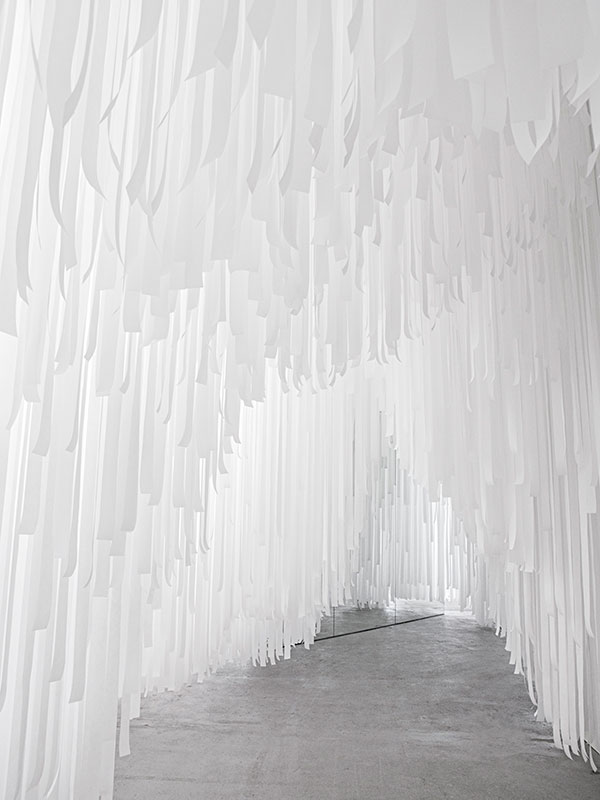 Snarkitecture creates a &rsquo;&rsquo;cave&rsquo;&rsquo; with paper-tissued suspended waves