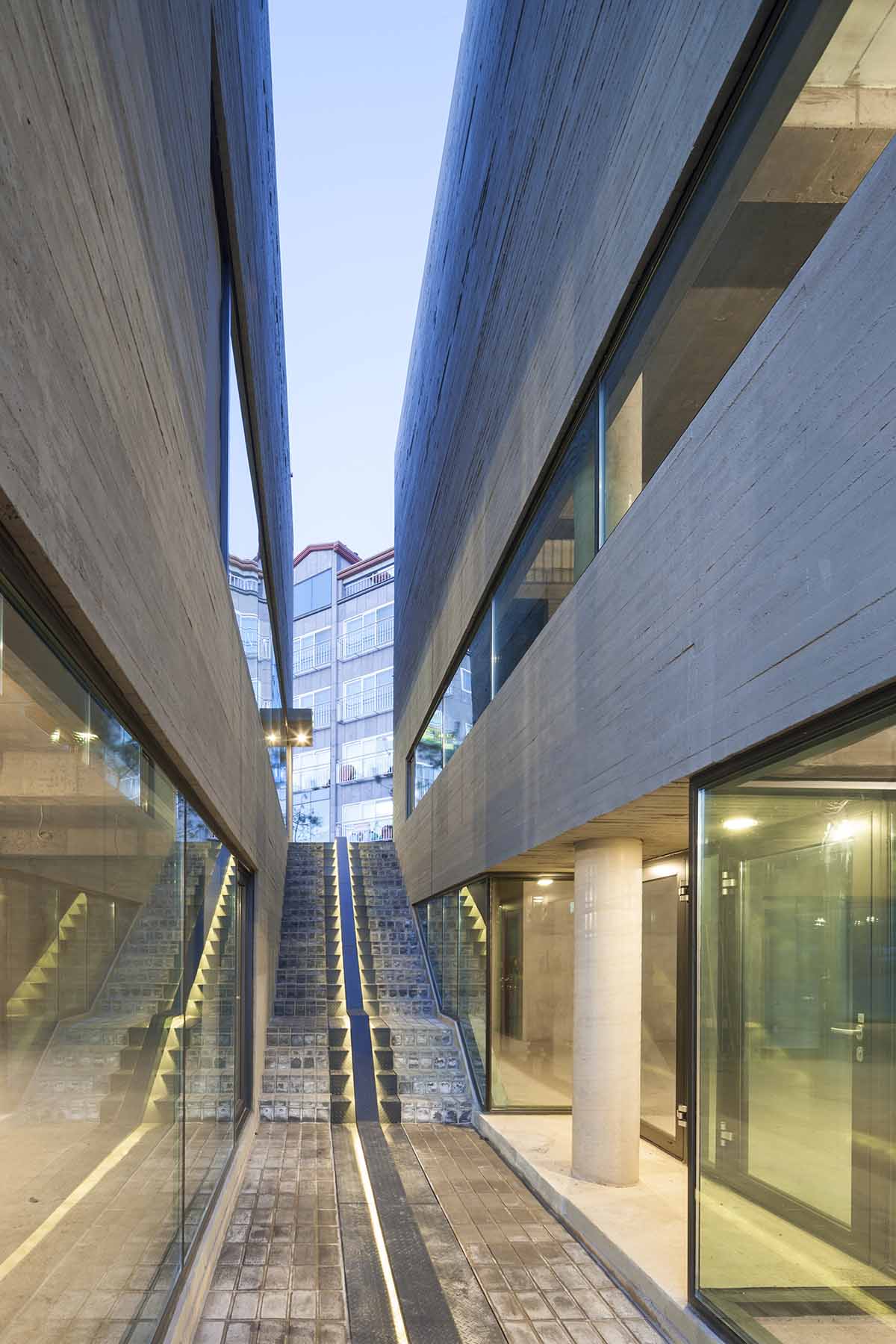 Moon Hoon Architects completed ’’Two Moon’’: a multi use building comprises two-segmented pieces