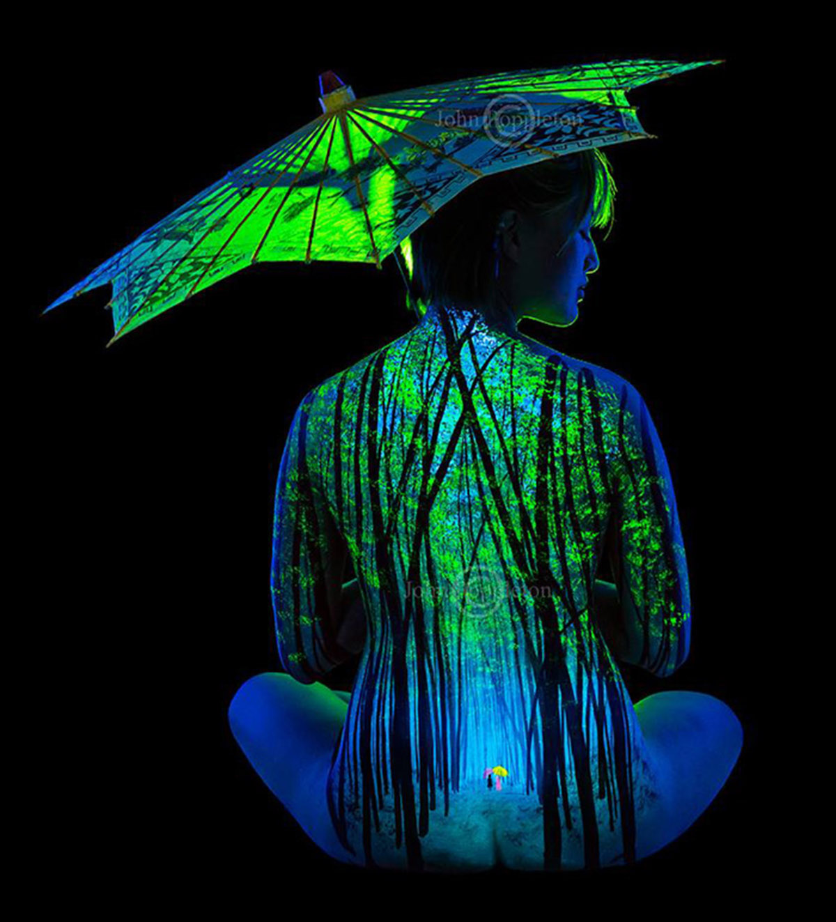 Lighting revives in body paintings that shine with back lights
