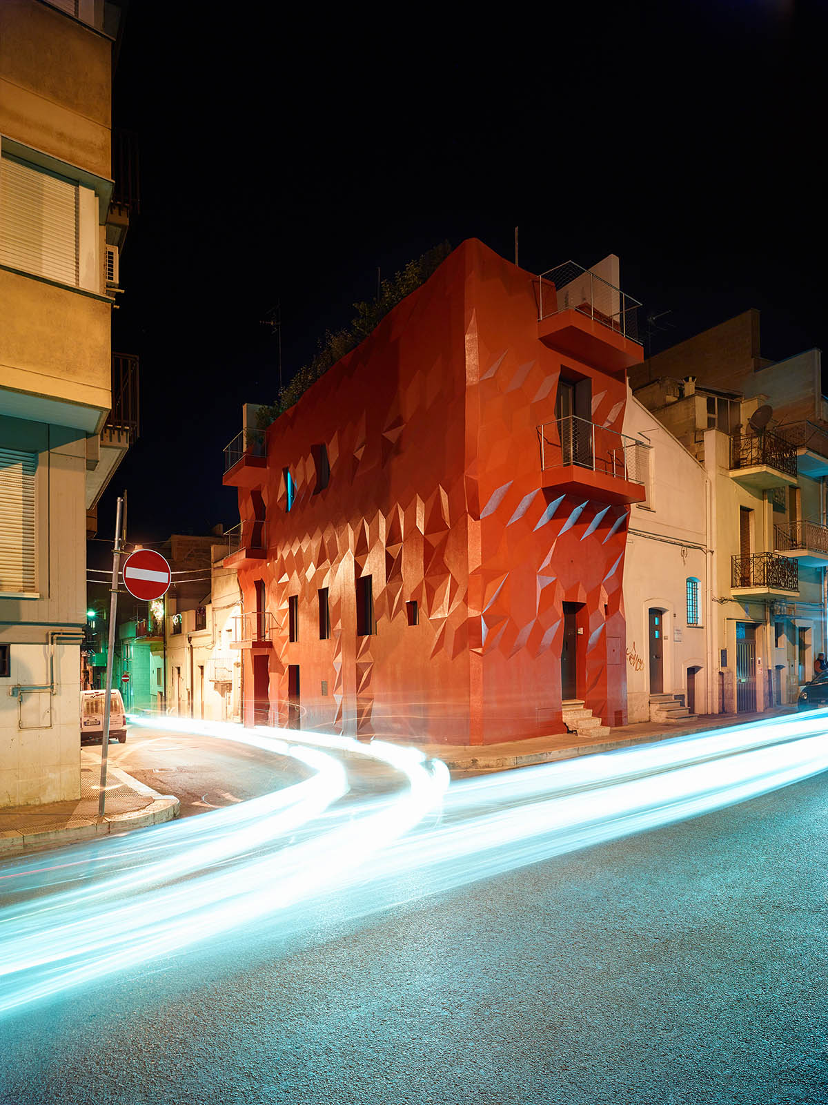 GG-Loop designs a vivid, wavy red facade for Italy’s historic house