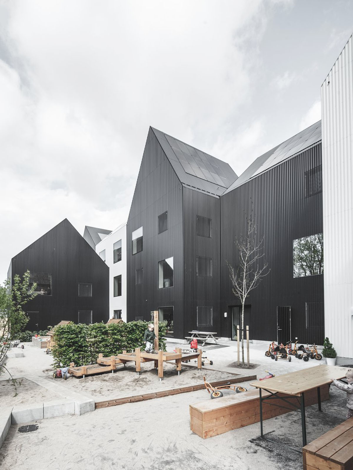 Frederiksvej Kindergarten is a warmly ’new playful village’ for children designed by COBE