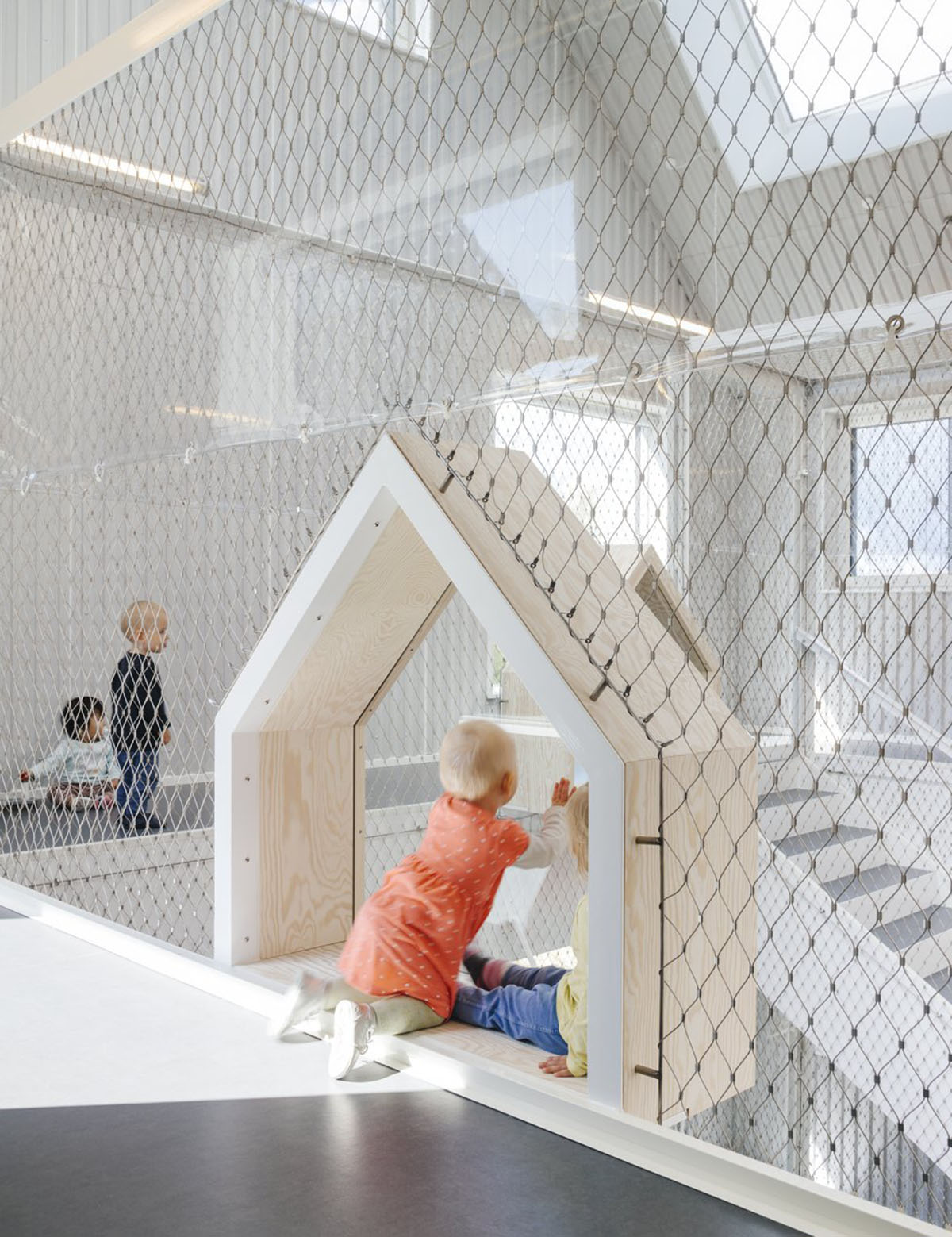 Frederiksvej Kindergarten is a warmly ’new playful village’ for children designed by COBE