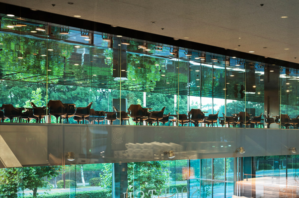 Nendo transforms Kenzo Tange’s original design into a coffee space by covering with mirrored surfaces