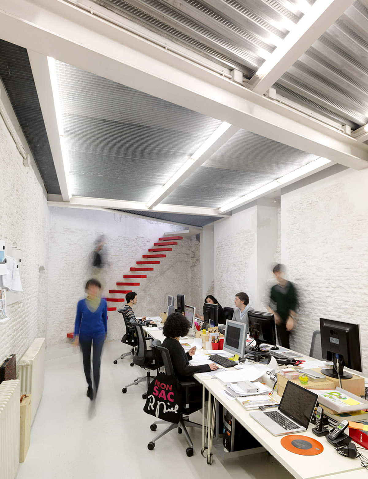 Ecosistema Urbano Office converted from an old storage that presents a very flexible space