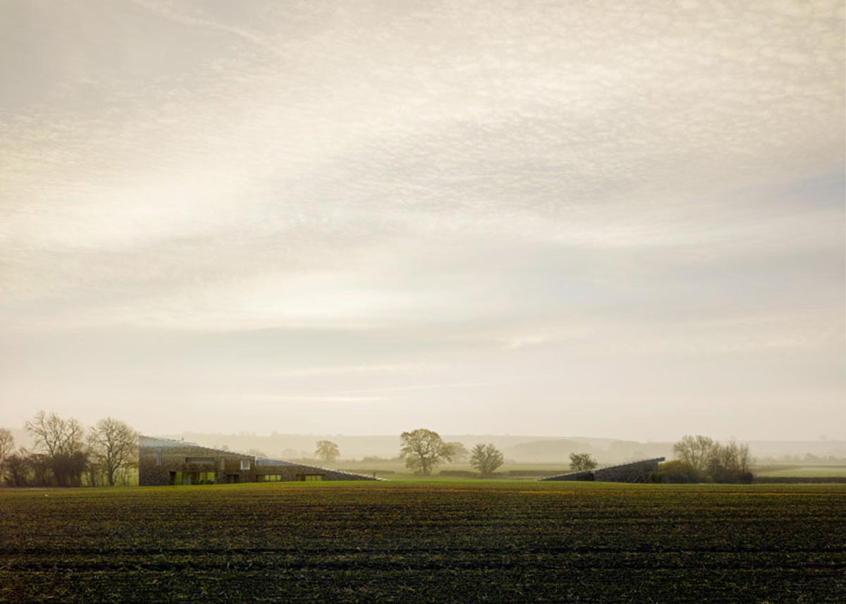 Flint house is an extension of landscape and geological extrusion referring to contemporary stone age