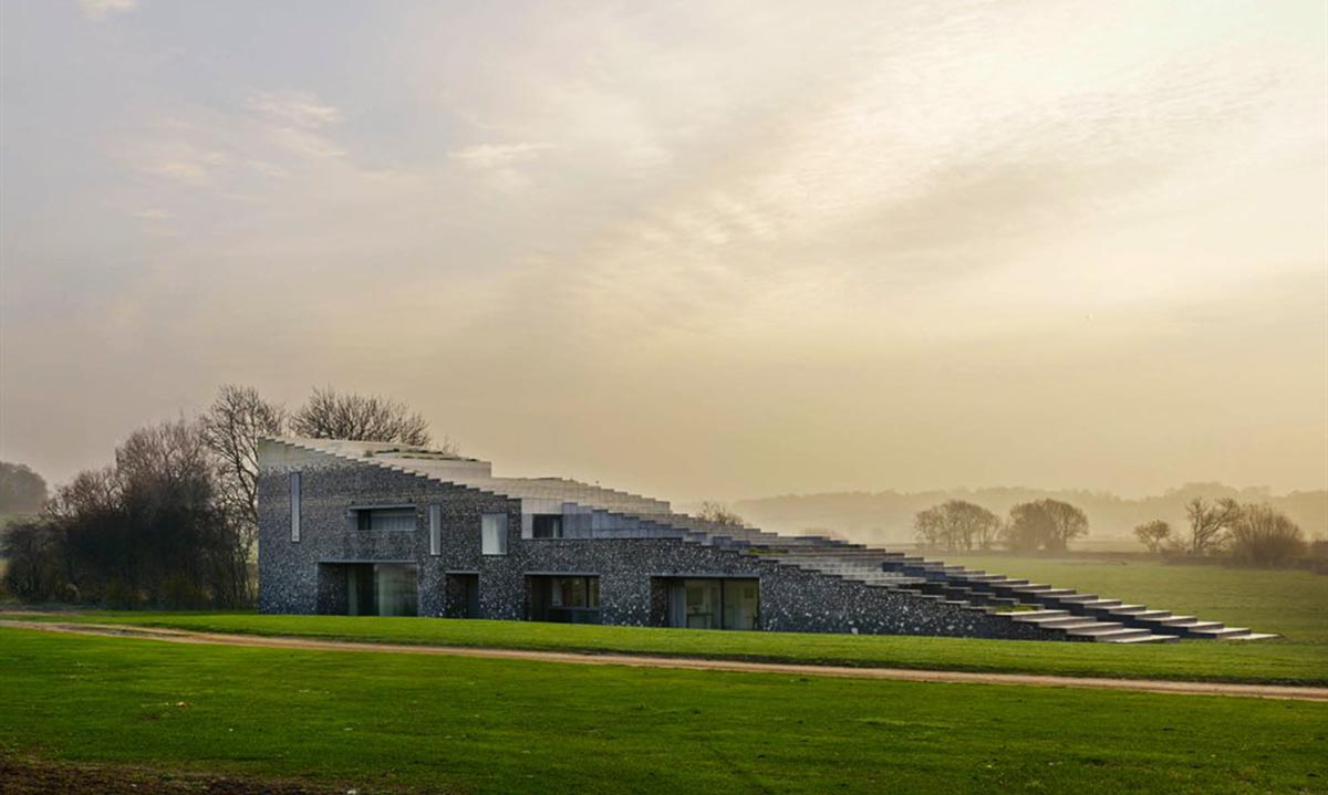 Flint house is an extension of landscape and geological extrusion referring to contemporary stone age