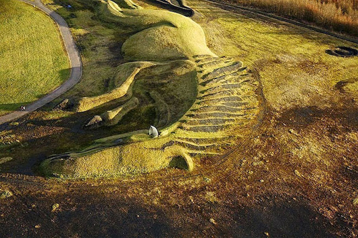 A giant horse earth sculpture integrated with natural landscape in UK