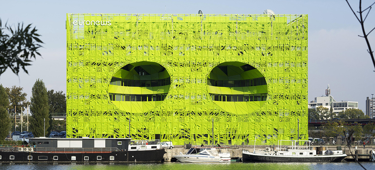 Jacob+Macfarlane’s Euronews HQ becomes a new iconic landmark with its luminous green presence