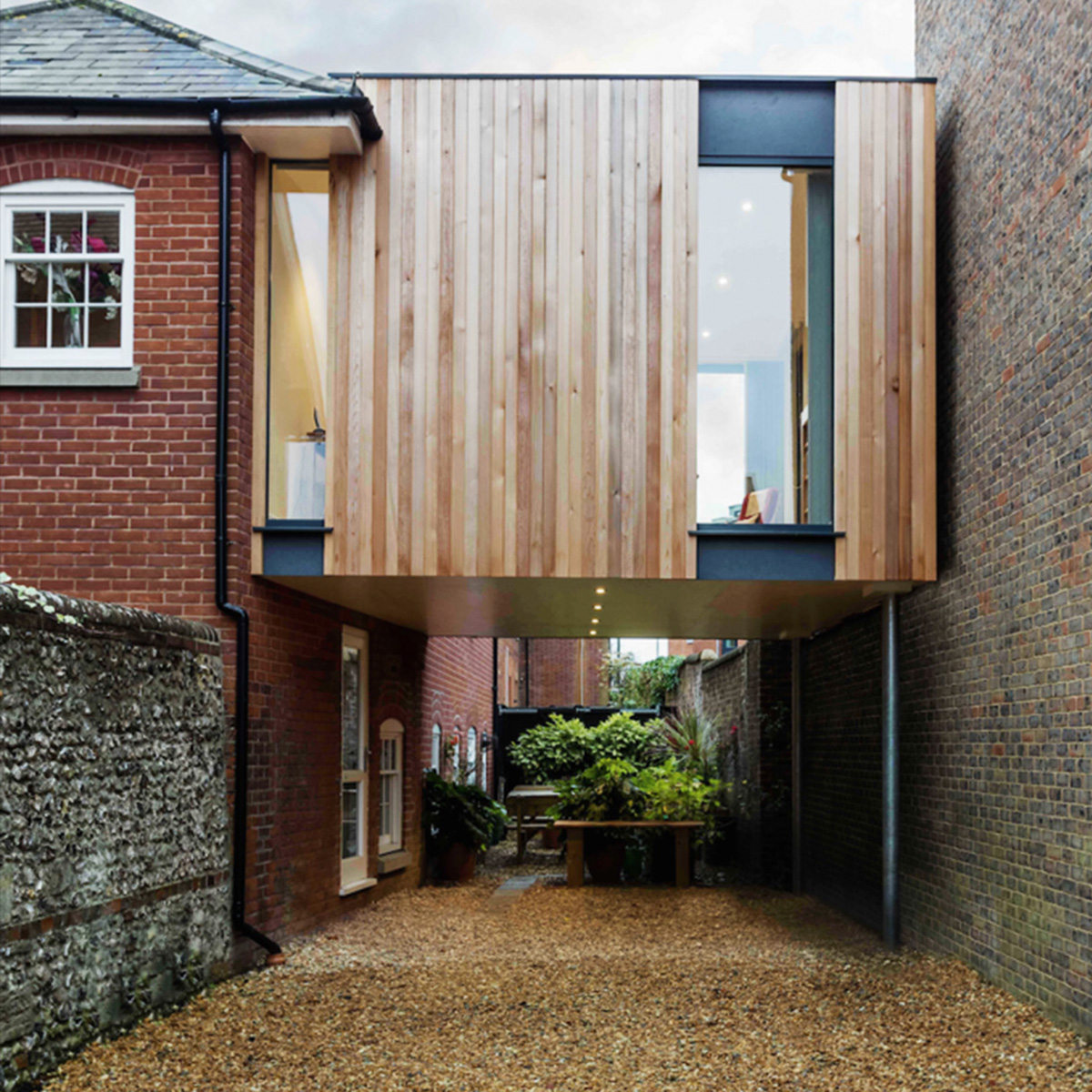 Adam Knibb Architects fills old school site with timber-box addition in Winchester