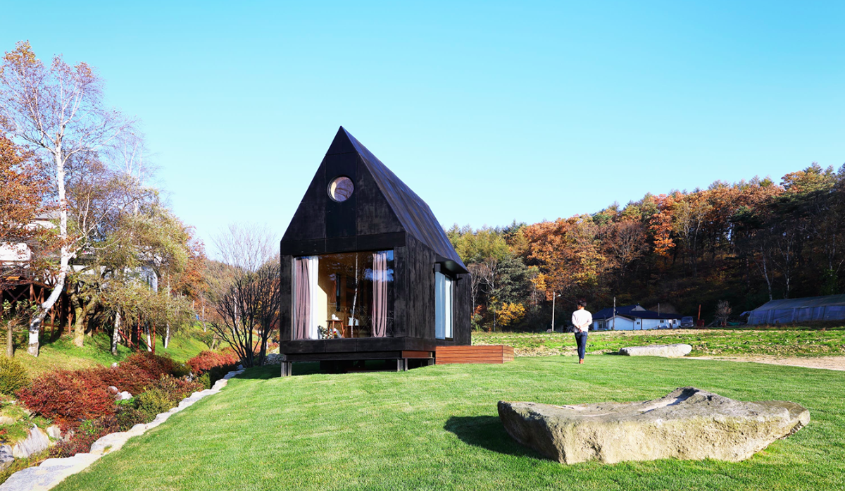 A Tiny House Of Slow Town by The Plus Partners+DNC Architects creates a minimum footprint
