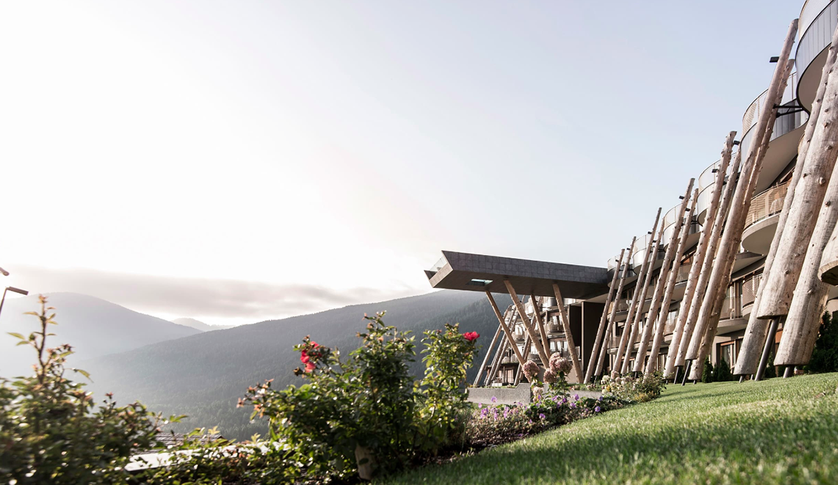 NOA’s Hubertus Hotel in Italy features cantilevering pool looking natural topography of the town