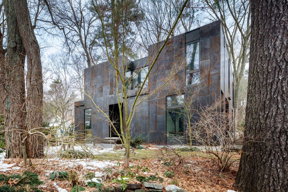 Merge Architects clads this family house with tree-trunk hue weathering steel panels in Lexington