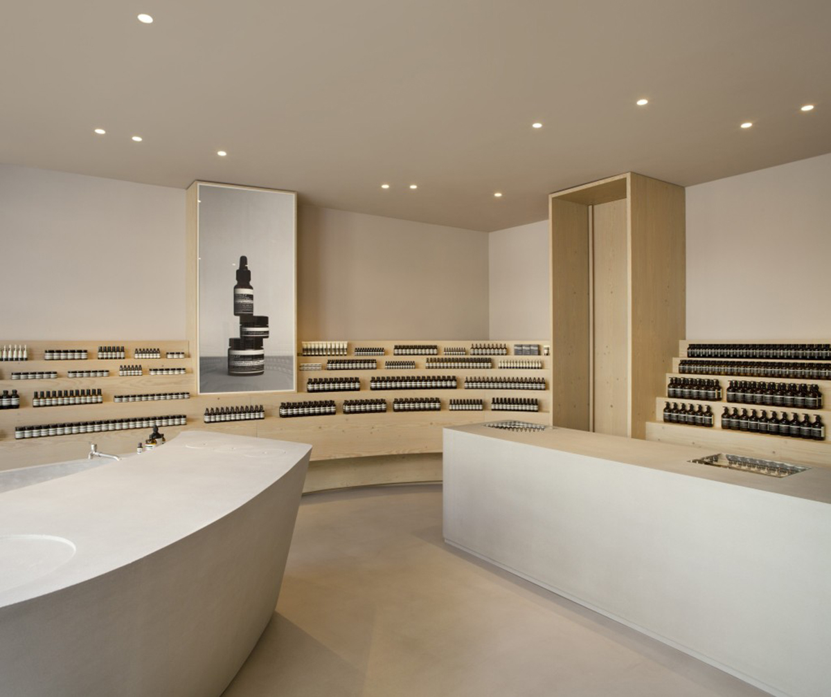 Snøhetta designed curvilinear wooden shelves with pastel colours for Aesop’s new Düsseldorf store