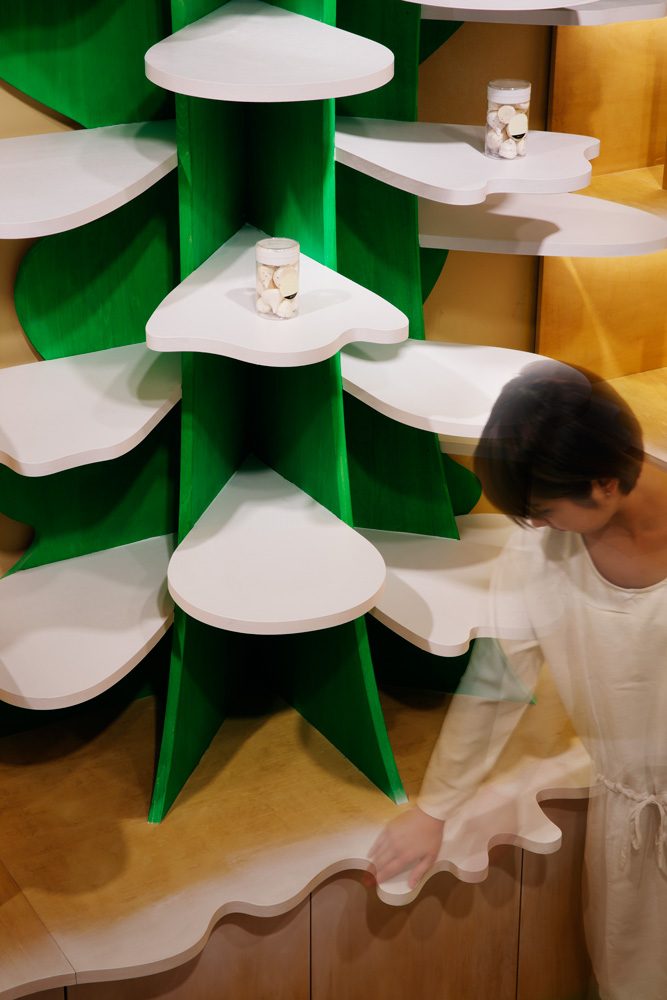 Moriyuki Ochiai Architects combines milky and forested tones with energetic patterns in MOMOM shop