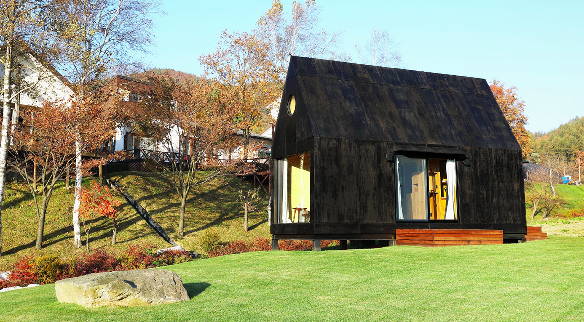 A Tiny House Of Slow Town by The Plus Partners+DNC Architects creates a minimum footprint