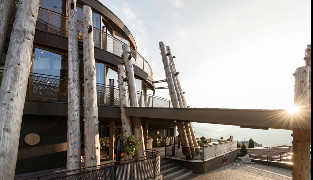 NOA’s Hubertus Hotel in Italy features cantilevering pool looking natural topography of the town