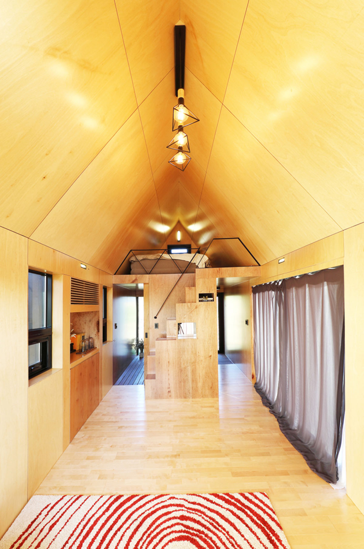 A Tiny House Of Slow Town by The Plus Partners+DNC Architects creates a minimum footprint