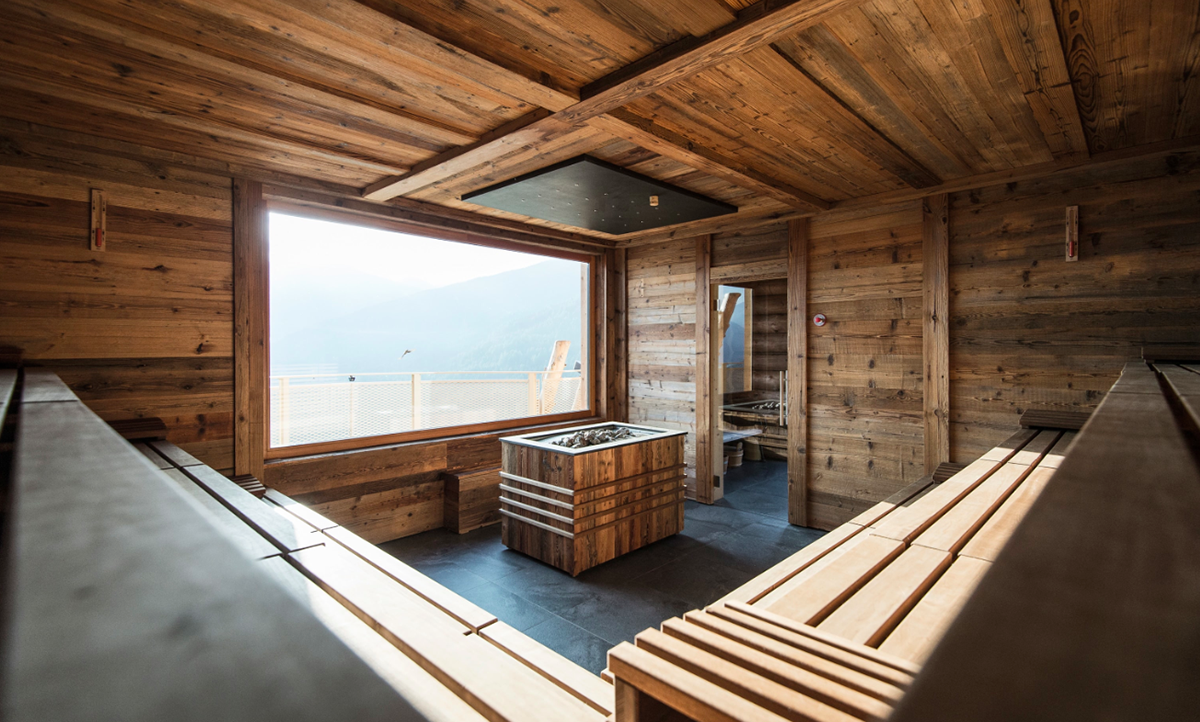 NOA’s Hubertus Hotel in Italy features cantilevering pool looking natural topography of the town