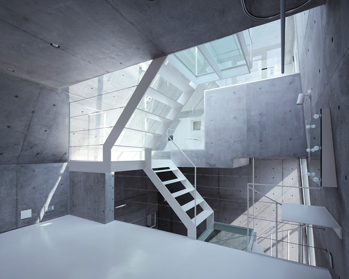 ’Tokyo House’ reflects interior living with a white abstract form emphasizing corner of the street