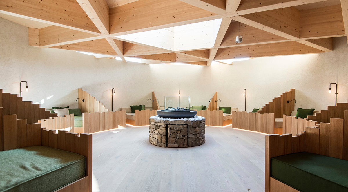 NOA’s Hubertus Hotel in Italy features cantilevering pool looking natural topography of the town