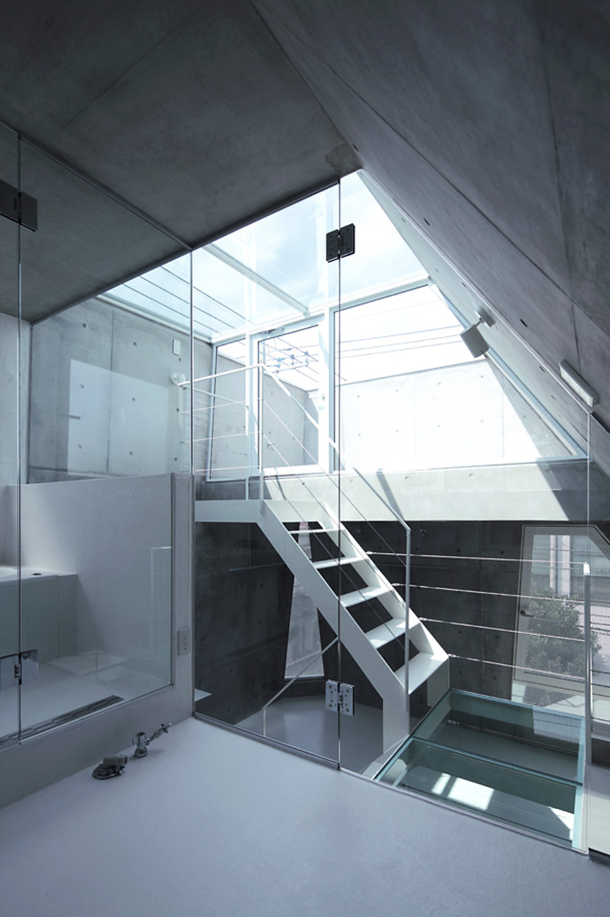 ’Tokyo House’ reflects interior living with a white abstract form emphasizing corner of the street