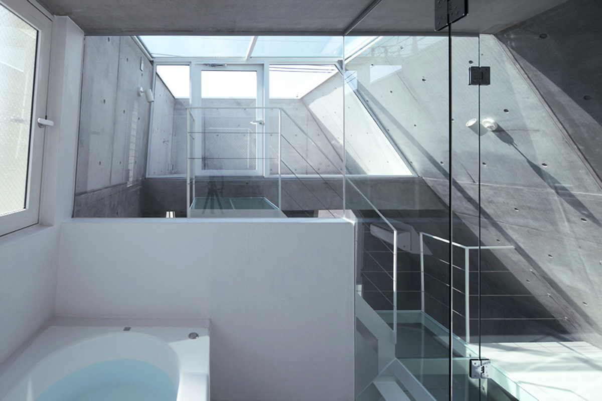 ’Tokyo House’ reflects interior living with a white abstract form emphasizing corner of the street