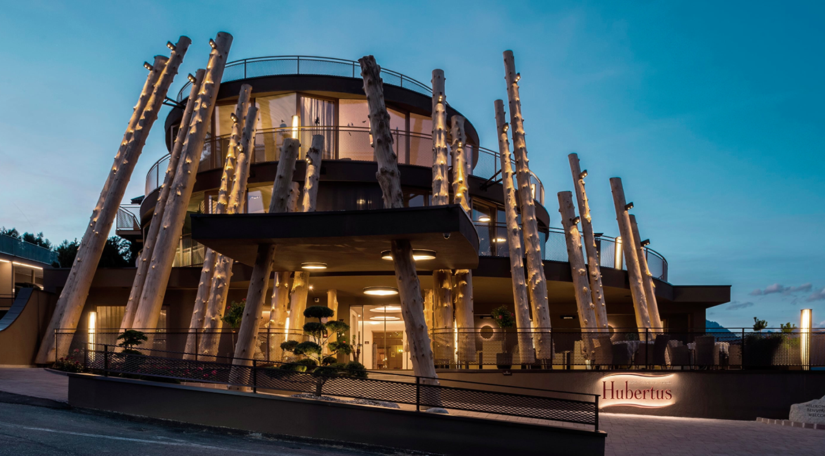 NOA’s Hubertus Hotel in Italy features cantilevering pool looking natural topography of the town