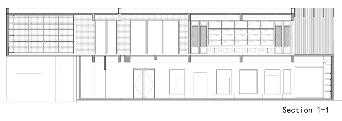 A red cedar grill placed on mottled worn walls of Ceramic House to preserve authenticity
