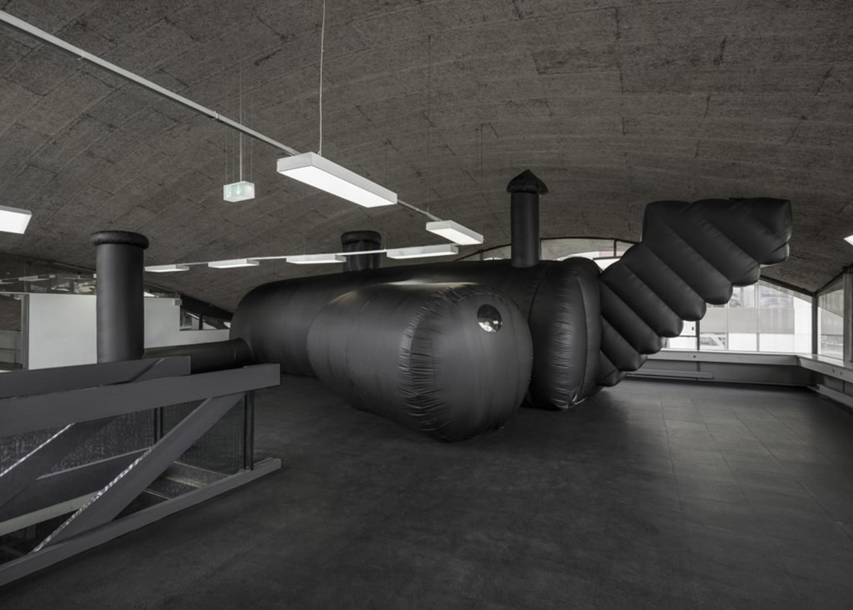 Bureau A designed an inflatable black shelter for a temporary nightclub made of PVC membrane