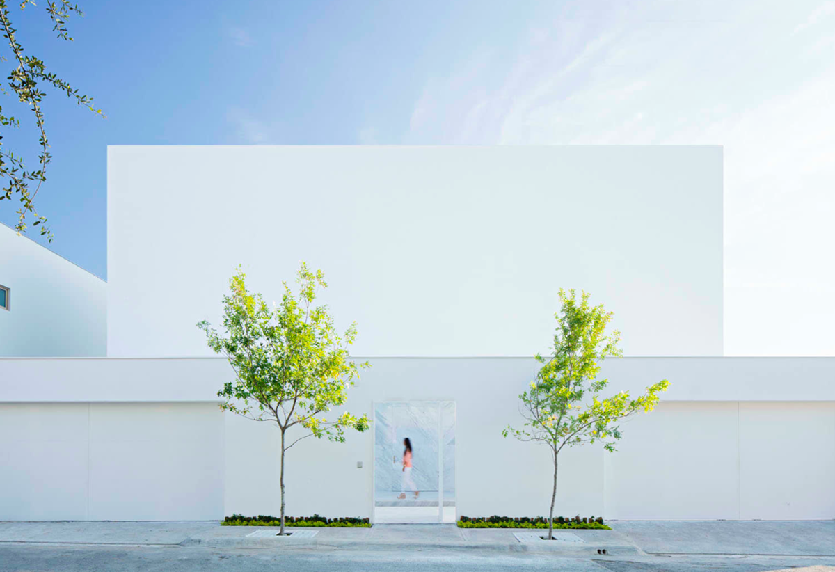 A nude-white house in Mexico filled with natural light and golden hue to create your dream house